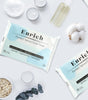 Enrich facial tissue packages on a light background with cotton and other items.