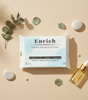 Enrich premium skincare facial tissue pack with hyaluronic acid, squalane and coconut oil, styled with skincare serum and natural leaves