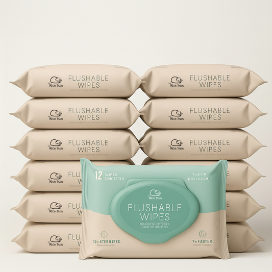 Multiple packages of flushable wipes with a prominent package in the foreground on a light beige background.