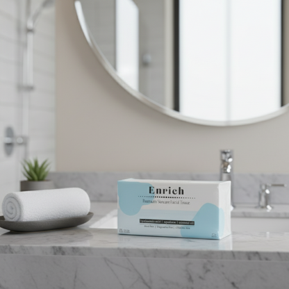 Box of Enrich facial tissues on a bathroom counter with a mirror in the background